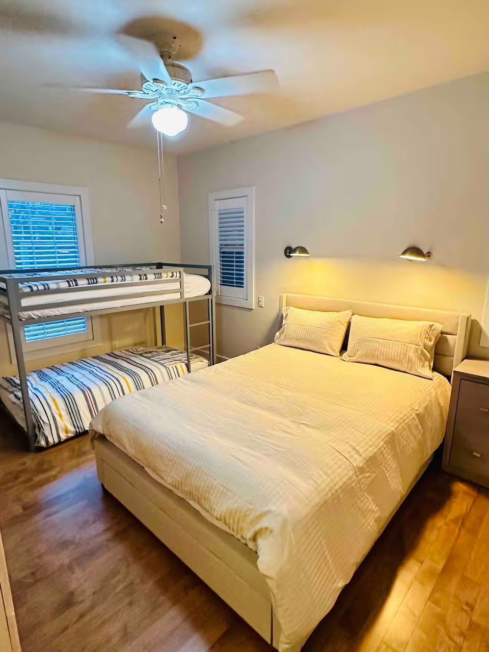 Bedroom with a queen bed and bunk bed at Modern Cozy Home