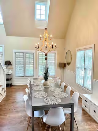Dining room with chandelier at Modern Cozy Home
