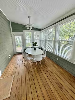 Window-lined sunroom at Modern Cozy Home