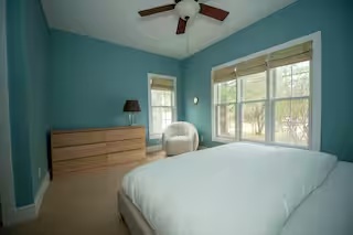 Blue bedroom with queen bed at Spacious Modern Hideaway