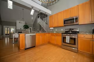 Orange-cabinet kitchen at Spacious Modern Hideaway