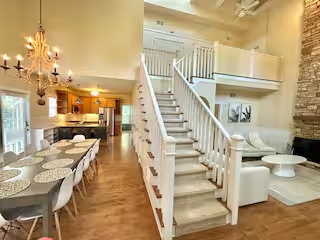 Open living room and staircase at Modern Cozy Home